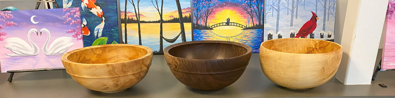 Three large wooden bowls turned by Mike Mahoney.