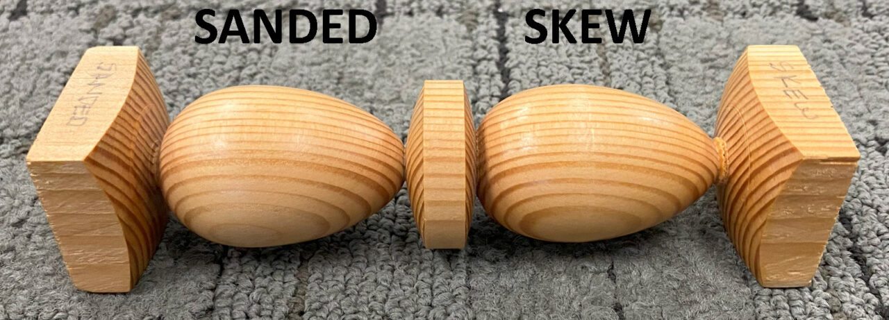 Two turned egg shapes that show a difference between surfaces: one egg is sanded, the other one is turned with a skew chisel.