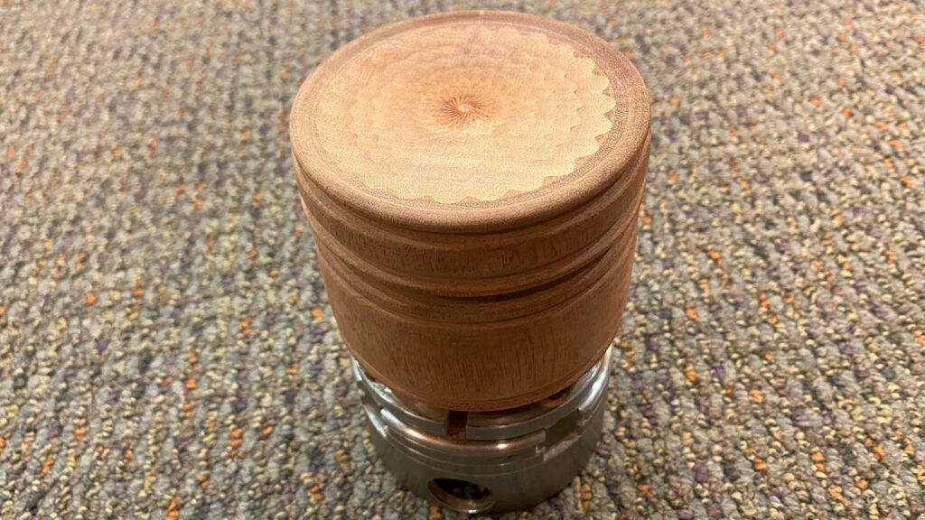 A lidded box mounted in a chuck