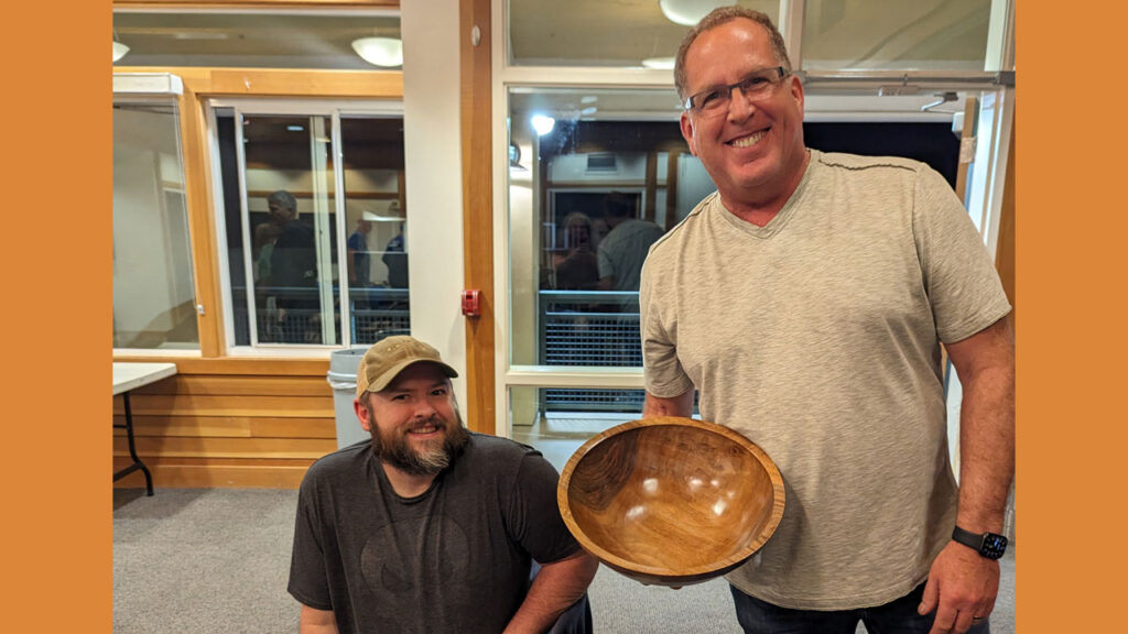 Dan Boehmke (right) shows his bowl. Nate Segraves is on the left.