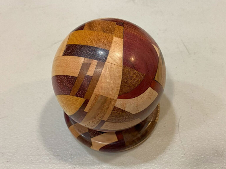 Harvey's turned perfect sphere. Turned from variety of different wood pieces.