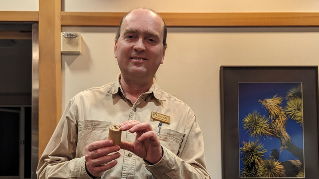 Roman Chernikov shows a stamp holder that he made in 2019