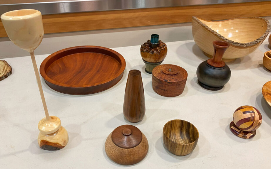 A table full of woodturning projects.