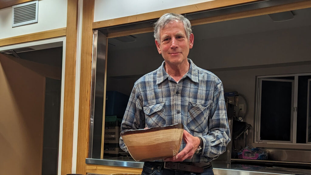 Tom Mandle shows his redwood bowl
