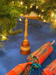 Turned Bell under a Christmas tree.